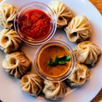 Veg Momos · Popular and favorite savory made by steaming dumplings stuffed with lightly spiced vegetable...