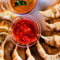 Chicken Momos · Steamed dumplings filled with lightly seasoned chicken filling, makes a great snack or appet...