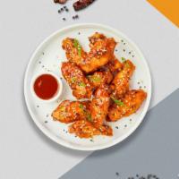 In Between Sweet And Sour Vegan Wings · Fresh vegan wings breaded, fried until golden brown, and tossed in sweet and sour sauce. Ser...