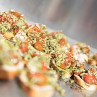 Bruschetta · House-baked bread brushed with Pesto and Olive Oil and topped with Tomatoes, Parmesan, Roast...