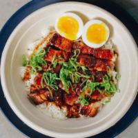 Adobo Bowl · Braised pork belly, adobo sauce, soft boiled egg, scallions, and rice.