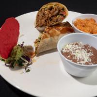 Pibil Carnitas Burrito · Shredded pibil pork carnitas wrapped in a flour tortilla, fresh guacamole, pico de gallo, li...