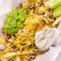 Carne Asada Fries · Topped with Guac and Sour Cream.