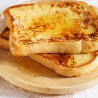 French Toast · Three slices of grilled french toast.