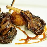 Grilled Spring Lamb Lollipops · Crispy goat cheese polenta croquettes, pine nut fig relish, pomegranate mint syrup