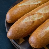 French Baguette · A classic baguette with a light, chewy interior and a crisp, golden crust. Perfect for toast...