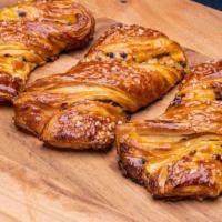 Chocolate Twist · Traditional croissant made with European style butter filled with almond cream and topped wi...