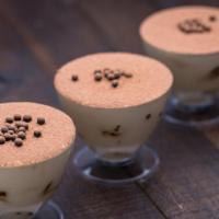 Each - Tiramisu Cup · Layers of mascarpone cream and coffee-soaked ladyfingers. Topped with cocoa powder and crisp...