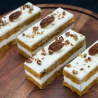 Slice - Carrot Cake Slice · A slice of moist carrot cake with pecan and pineapple layered with Porto's signature cream c...