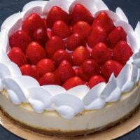 Fresh Strawberry Cheesecake · Classic cheesecake with a graham cracker crust finished with whole strawberries and a strawb...
