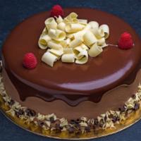 Chocolate Raspberry Cake Round · Moist chocolate cake layered with Porto's signature whipped chocolate ganache and raspberry ...