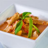Panang Curry · Spicy. Dry curry sautéed with coconut milk, bell peppers, and basil.