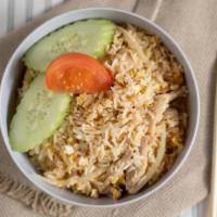 Fried Rice · Fried rice with egg and onions. Garnished with cucumbers and tomatoes, choice of chicken, be...