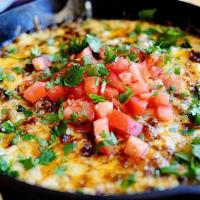 Queso Fundido · Melted oaxaca and Monterey Jack cheese served with your choice of chorizo or grilled mushroo...