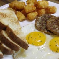 2 Eggs & 2 Sausage Patties · Two eggs your way with two sausage patties, choice of toast, and choice of side.