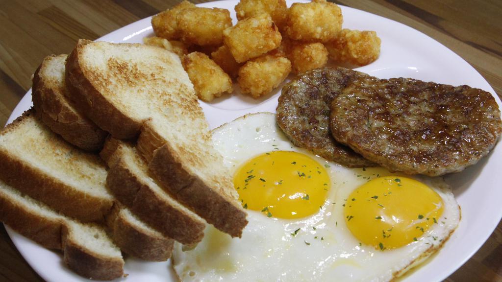 2 Eggs & 2 Sausage Patties · Two eggs your way with two sausage patties, choice of toast, and choice of side.