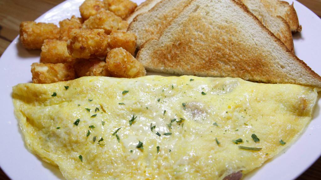 Denver Omelette · Ham, bell peppers, onions, and cheese. Served with choice of side and choice of toast.