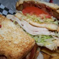 T-Bird · Triple decker on grilled white bread with turkey, bacon, lettuce, tomato and mayo.