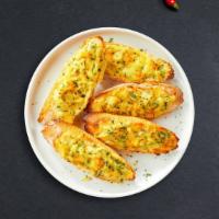 Make It A Cheesy Garlic Day · (Vegetarian) Housemade bread toasted and garnished with butter, garlic, mozzarella cheese, a...