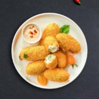 Jolly Jalapeño · (Vegetarian) Fresh jalapenos coated in cream cheese and fried until golden brown.