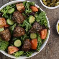 Beef  Salad · Romaine lettuce, tomatoes, and cucumbers with house dressing. 
Choice of Beef Shawarma or Be...