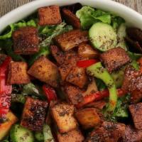 Fattoush · Topped with romaine lettuce, tomatoes, cucumbers, onions, green pepper, red pepper, chives &...