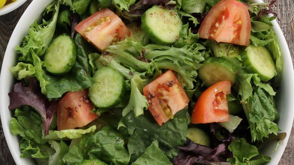 Garden · Romaine lettuce, tomatoes, and cucumbers with house dressing