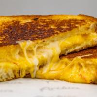 Grilled Cheese · Toasted sliced sourdough, muenster, mozzarella, cheddar.