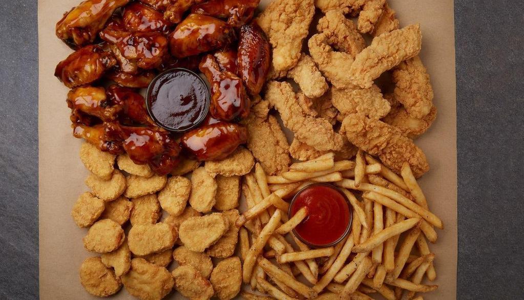Complete Coast Bundle  · Dinner, side, drinks, and dessert for four. 25 bone-in wings with your choice of flavor, 24 chicken nuggets, two pounds of house-seasoned fries, four fountain drinks, and four chocolate chunk cookies for dessert.
