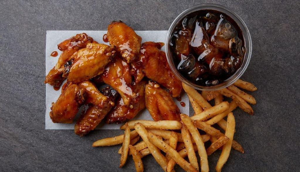 10 Piece Wing Combo  · Make it a combo! 10 bone-in wings tossed in your choice of up to two flavors, house-seasoned french fries, and a fountain drink.