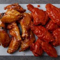 25 Wings  · 25 bone-in wings tossed in your choice of up to two flavors