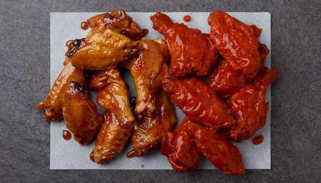50 Wings · 50 bone-in wings tossed in your choice of up to two flavors