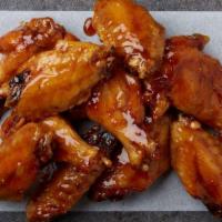 10 Wings · 10 bone-in wings tossed in your choice of up to two flavors.