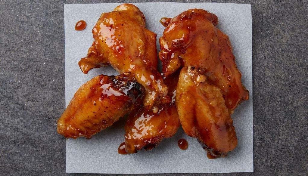 5 Wings · 5 bone-in wings tossed in your choice of flavor.