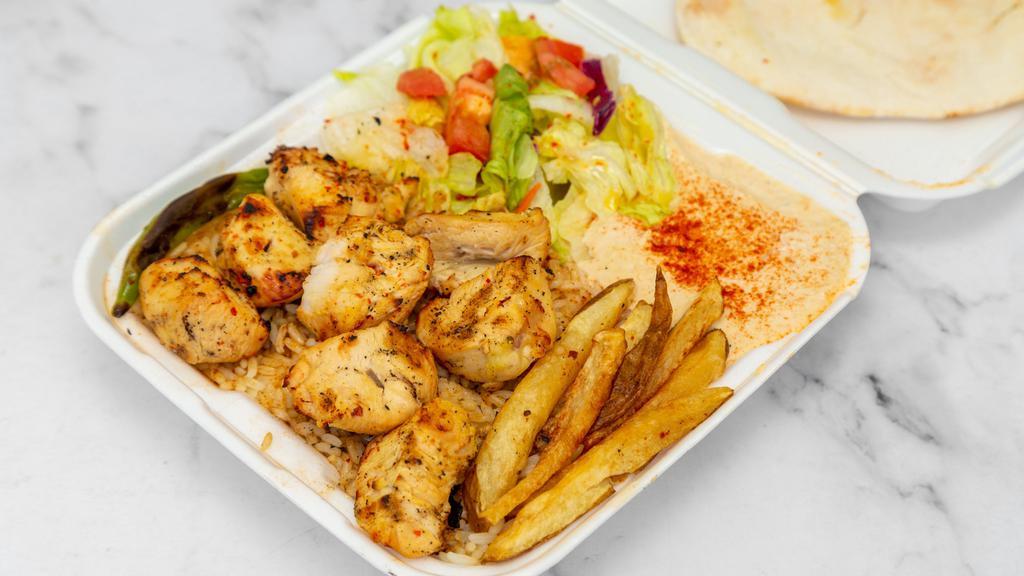 Chicken Kabob Plate · Marinated boneless skinless chicken breast. Served with hummus, salad, rice and pita bread.