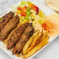 Kofta Lula Kabob Plate · Flame-broiled beef seasoned with onions, parsley and spices. Served with hummus, salad, rice...