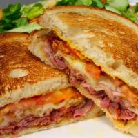 Pastrami Delight Sandwich · Thinly sliced pastrami with mustard, swiss cheese, tomato, and red onion.  Comes with a side...