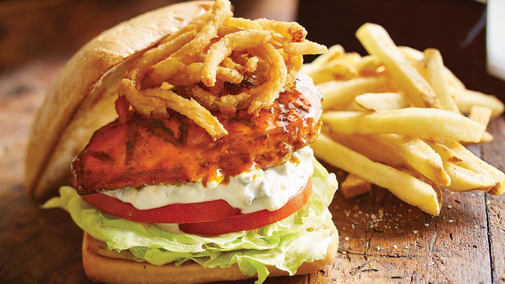 Buffalo Chicken Sandwich · Grilled hard roll, fried chicken breast, house Buffalo or wing sauce. Served with choice of crispy french fries, sweet potato fries or kettle chips and a pickle.