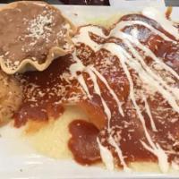 Enchiladas Jalisco · Two tortillas filled with shredded chicken and Monterey Jack cheese, topped with red or gree...