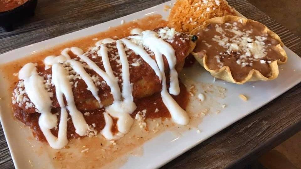 Cheese Enchiladas · Two tortillas filled with Monterey Jack cheese, topped with red or green salsa, queso fresco, and sour cream. Served with rice and beans.