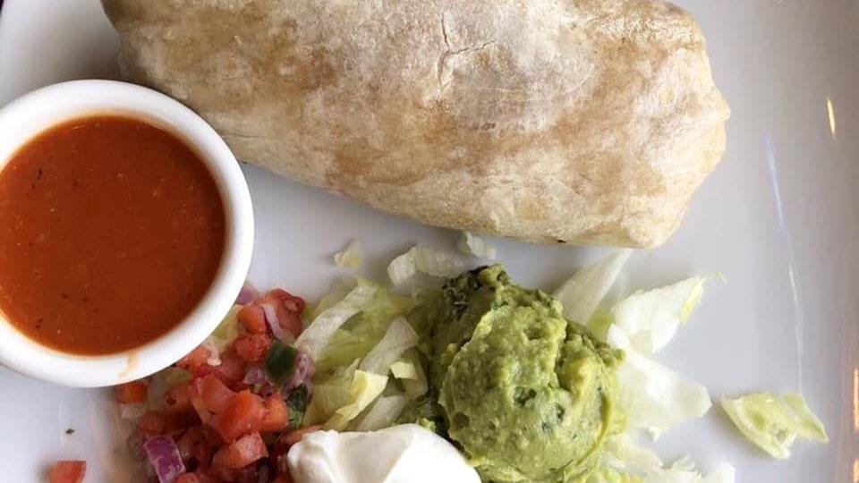 Chimichanga · A fried burrito filled with shredded chicken, pinto beans, rice, and Monterey Jack cheese. Served with sour cream, guacamole, and Pico De Gallo.