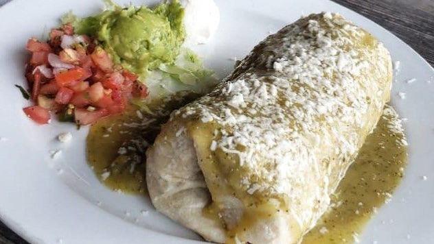Chile Relleno Burrito · Chile poblano filled with rice, beans, and Monterey jack cheese, wrapped in a large flour tortilla topped with green salsa. Served with sour cream, guacamole, and pico de gallo.