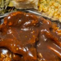 Jeff’S  Smothered Pork Chop Dinner And 2 Sides  · Any meat you choose over rice and gravy with 2 sides