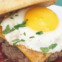 Rooster Burger · Grass Fed Beef Patty, Cheddar Cheese, Sunny Egg Served on a Ciabatta Bun