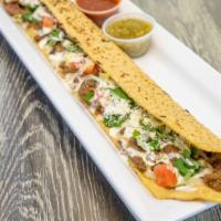 Machete · Made from scratch, 24 inches long corn tortilla, with cheese and your choice of fillings, fi...