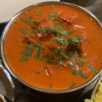 Chicken Tikka Masala · Chicken cooked in a rich creamy tomato based curry