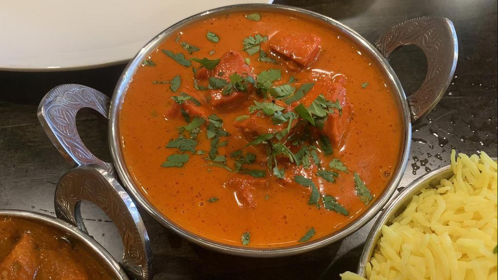 Chicken Tikka Masala · Chicken cooked in a rich creamy tomato based curry