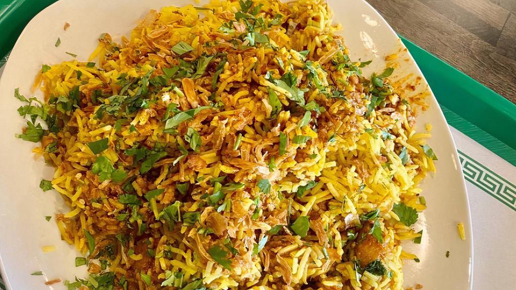 Chicken Biryani · Made with basmati rice, spices and chicken
