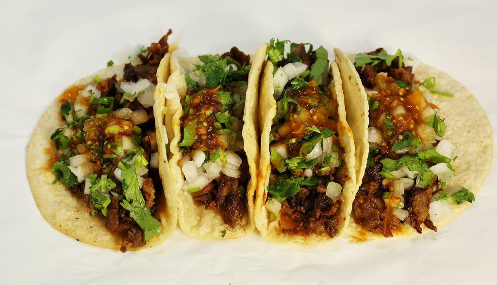 Home Made Tacos · Soft Home Made Corn tortilla, your choice of Meat, garnished with Onions, Cilantro and Our Secret Salsa.