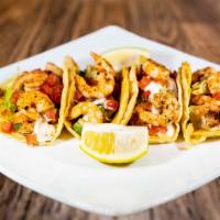Tacos De Camaron / Shrimp Tacos · Soft, corn tortilla, with shrimp, our secret salsa, chopped onions, garnished with lettuce, ...